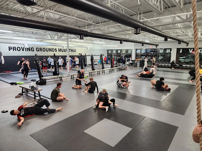 Students training BJJ and Muay Thai on the mats at Proving Grounds in Shelby Township.